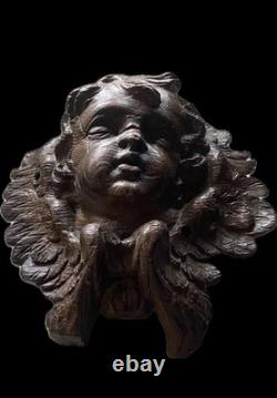 18th-century wooden sculpture of an old religious cherub angel	


<br/>		