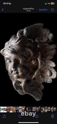 18th-century wooden sculpture of an old religious cherub angel 

<br/>