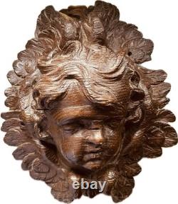 18th-century wooden sculpture of an old religious cherub angel
<br/> 