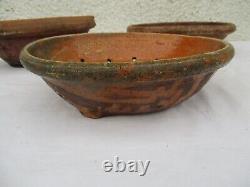 2 Terracotta strainers, 1 glazed cream bowl and skimmer, 19th Century