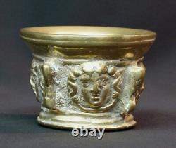 An old beautiful 19th-century mortar, 1.5 kg cut, gilded bronze medallion