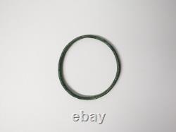 Ancient bronze bangle bracelet decorated with geometric motifs, Roman era
