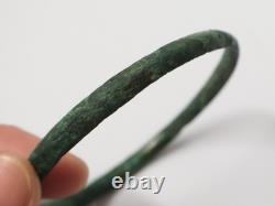 Ancient bronze bangle bracelet decorated with geometric motifs, Roman era