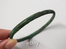 Ancient bronze bangle bracelet decorated with geometric motifs, Roman era