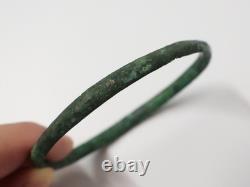 Ancient bronze bangle bracelet decorated with geometric motifs, Roman era