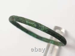 Ancient bronze bangle bracelet decorated with geometric motifs, Roman era