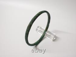 Ancient bronze bangle bracelet decorated with geometric motifs, Roman era
