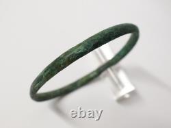 Ancient bronze bangle bracelet decorated with geometric motifs, Roman era
