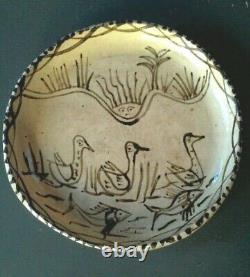 Ancient glazed dish. Zoomorphic ceramic.