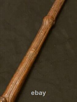 Ancient grotesque folk art cane