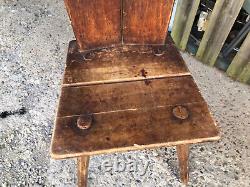 Ancient solid wood chair in popular Queyras or Savoie style mountain cottage decoration