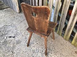 Ancient solid wood chair in popular Queyras or Savoie style mountain cottage decoration