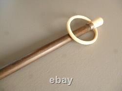 Ancient wooden walking stick with glove holder handle