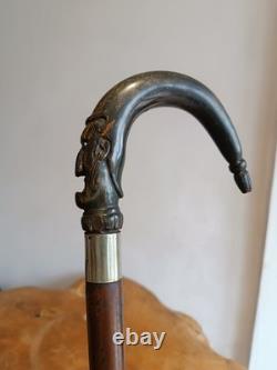 Antique Walking Stick with a Carved Ebony Handle