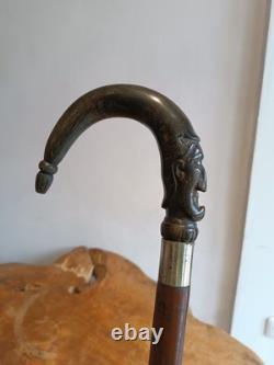 Antique Walking Stick with a Carved Ebony Handle