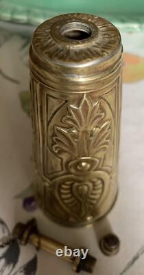 Antique brass priming powder flask with embossed decoration, 19th century