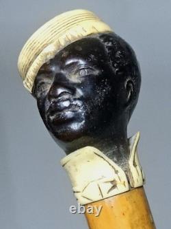 Antique dandy’s cane, late 19th century, ebony carved handle with a black man’s head pommel