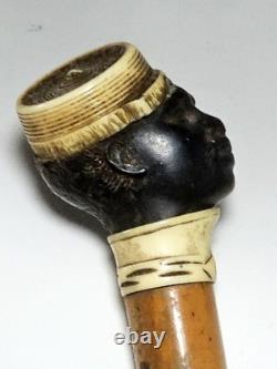 Antique dandy’s cane, late 19th century, ebony carved handle with a black man’s head pommel