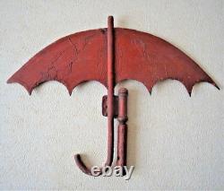 Antique street sign of an umbrella and parasol merchant