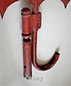 Antique street sign of an umbrella and parasol merchant