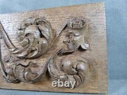 Carved Oak Bas-relief in Renaissance Style with 4 Heads and Scrollwork Decoration