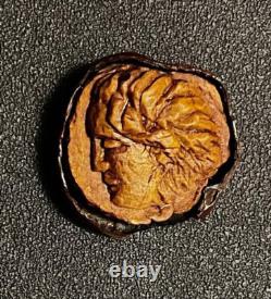 Carved chestnut profile portrait of a woman, 19th-century folk art work