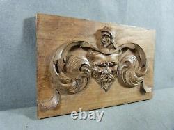 Carved oak bas-relief in Renaissance style with Devil head decor