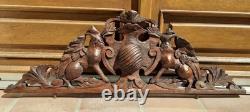 Carved wooden pediment with griffin decoration, late 19th to early 20th century