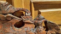Carved wooden pediment with griffin decoration, late 19th to early 20th century