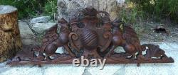 Carved wooden pediment with griffin decoration, late 19th to early 20th century