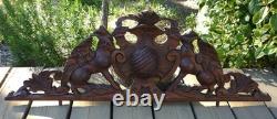 Carved wooden pediment with griffin decoration, late 19th to early 20th century