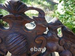 Carved wooden pediment with griffin decoration, late 19th to early 20th century