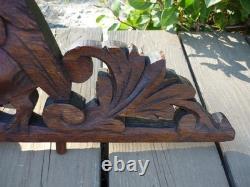 Carved wooden pediment with griffin decoration, late 19th to early 20th century