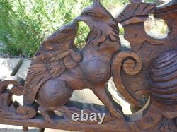 Carved wooden pediment with griffin decoration, late 19th to early 20th century