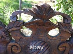Carved wooden pediment with griffin decoration, late 19th to early 20th century