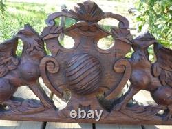 Carved wooden pediment with griffin decoration, late 19th to early 20th century