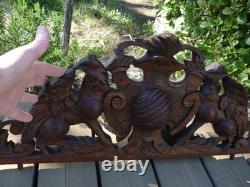 Carved wooden pediment with griffin decoration, late 19th to early 20th century