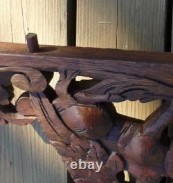 Carved wooden pediment with griffin decoration, late 19th to early 20th century