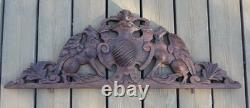 Carved wooden pediment with griffin decoration, late 19th to early 20th century