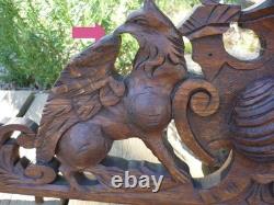 Carved wooden pediment with griffin decoration, late 19th to early 20th century