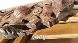 Carved wooden pediment with griffin decoration, late 19th to early 20th century