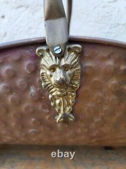 Copper log holder with lion feet. Ceramic handle