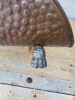 Copper log holder with lion feet. Ceramic handle