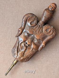 Fireplace bellows with ear-shaped baroque-style masks, carved walnut wood, 19th century
