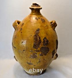 GLAZED TERRACOTTA CONSCIENCE WITH YELLOW SLIP AND FOUR LOOPS XIX CENTURY PROVENCE