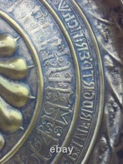 Large brass offering dish, 17th century