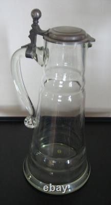 Large covered pitcher in blown glass, 19th century, slightly bubbled antique glass