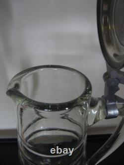 Large covered pitcher in blown glass, 19th century, slightly bubbled antique glass