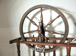 Large wool spinning wheel and its miniature, 19th-century folk art