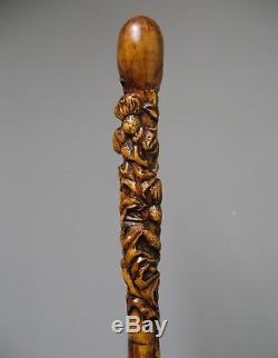 Old Wooden Carved Walking Stick. Thistles. Folk Art